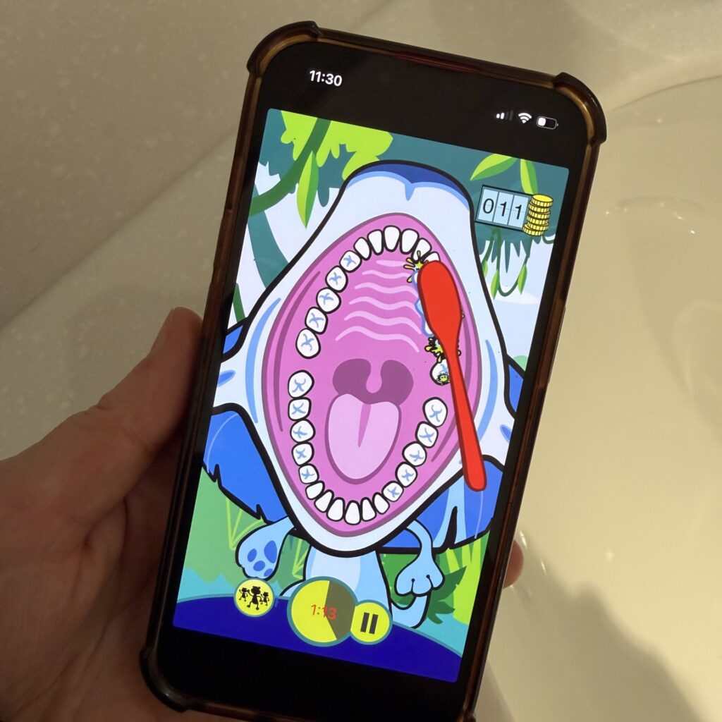 Chomper Chums App shows kids how to brush, timing them for two minutes.