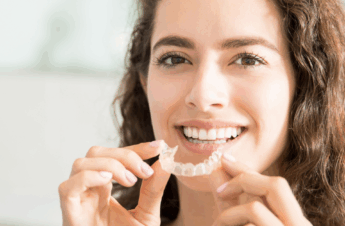 woman showing of her clear retainer